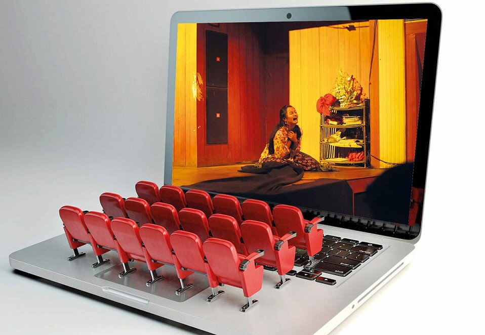 Image of miniature seats lined up on a laptop to resemble a virtual theatre.